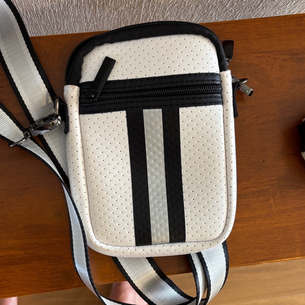 HAUTE SHORE Casey Dash  White and Black Crossbody Phone Pouch -